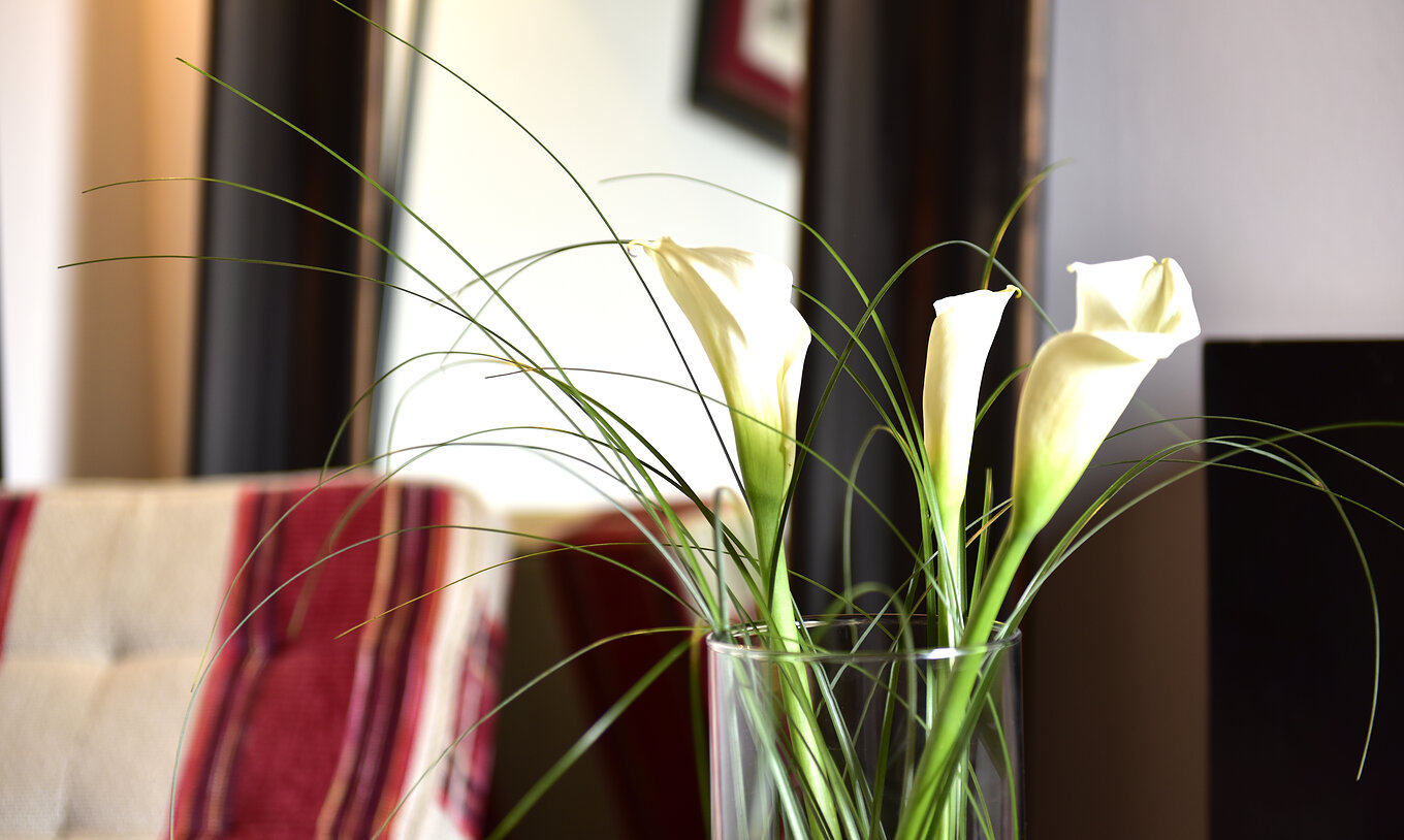 The Classic Room of The Pousada Marvão features various decorative elements, such as a vase with white flowers