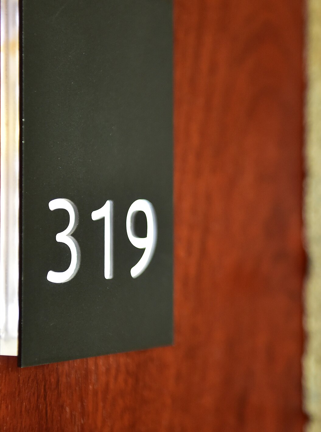 The Classic Family of the Pousada Viseu has a room door made of wood, with stone around
