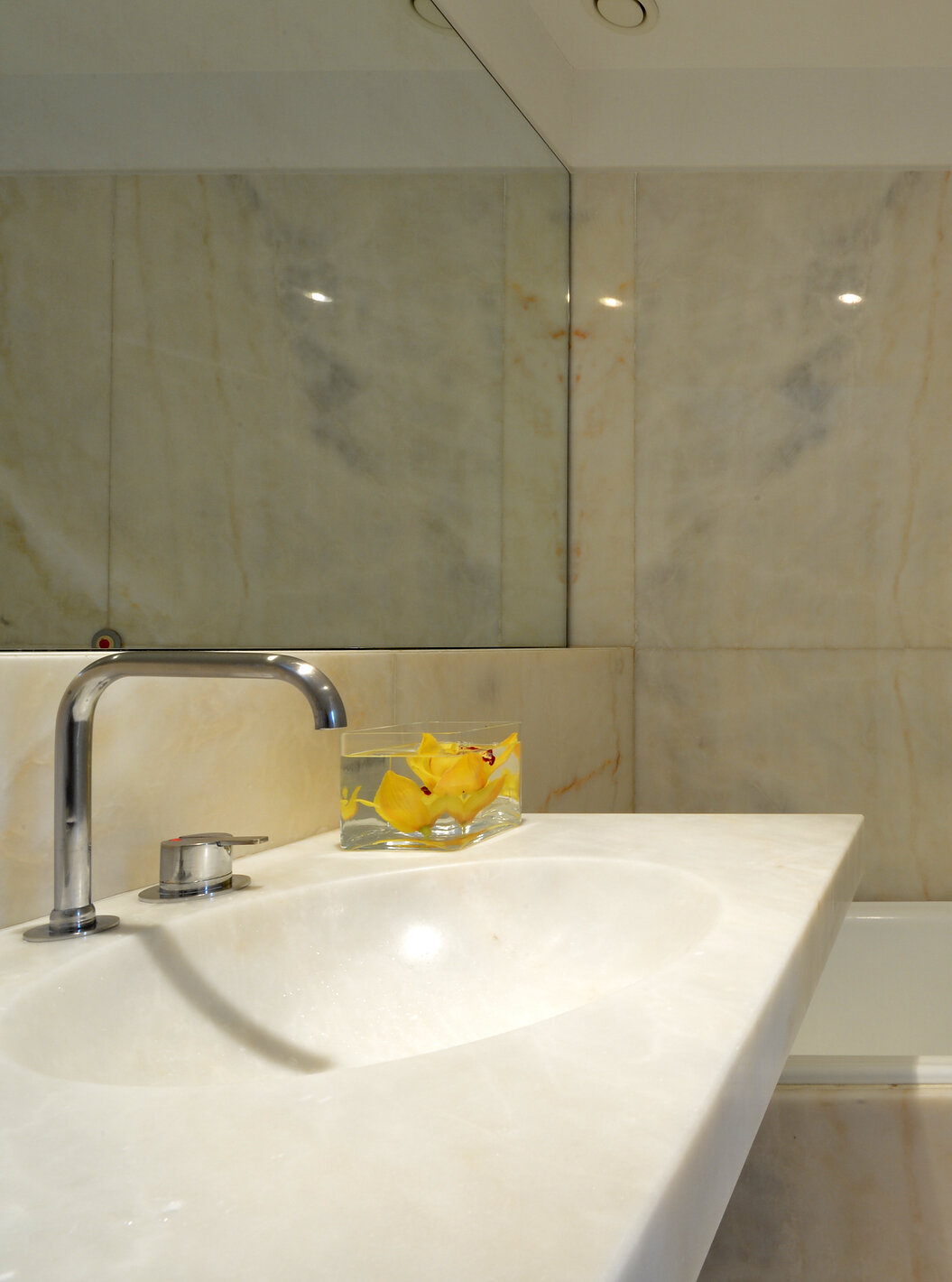 The Superior Room of The Pousada Mosteiro Amares features a marble bathroom with a bathtub and sink