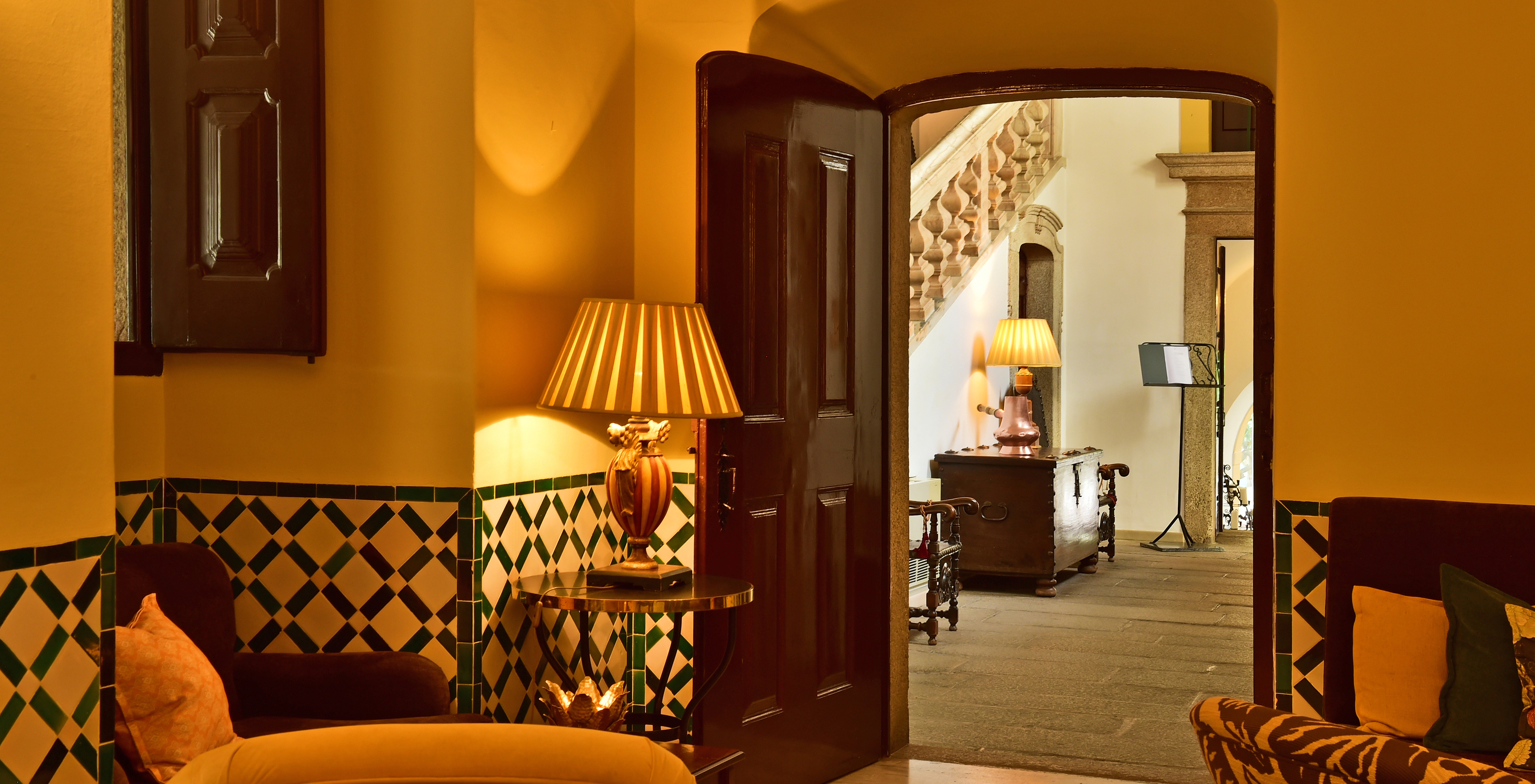The Pousada Convento Évora has an entrance with sofas and lamps