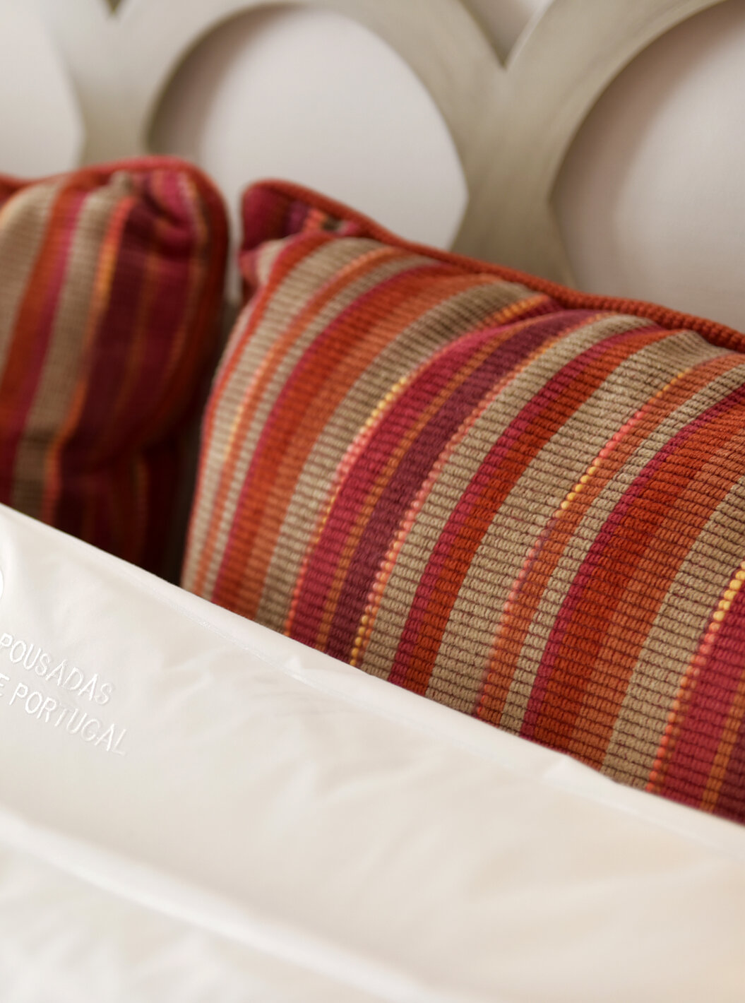 The Double Room of The Pousada Marvão features customized white cushions and striped cushions