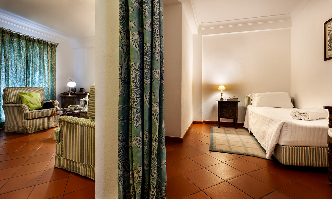 The Family Suite of The Pousada Marvão features a single bed and a living room