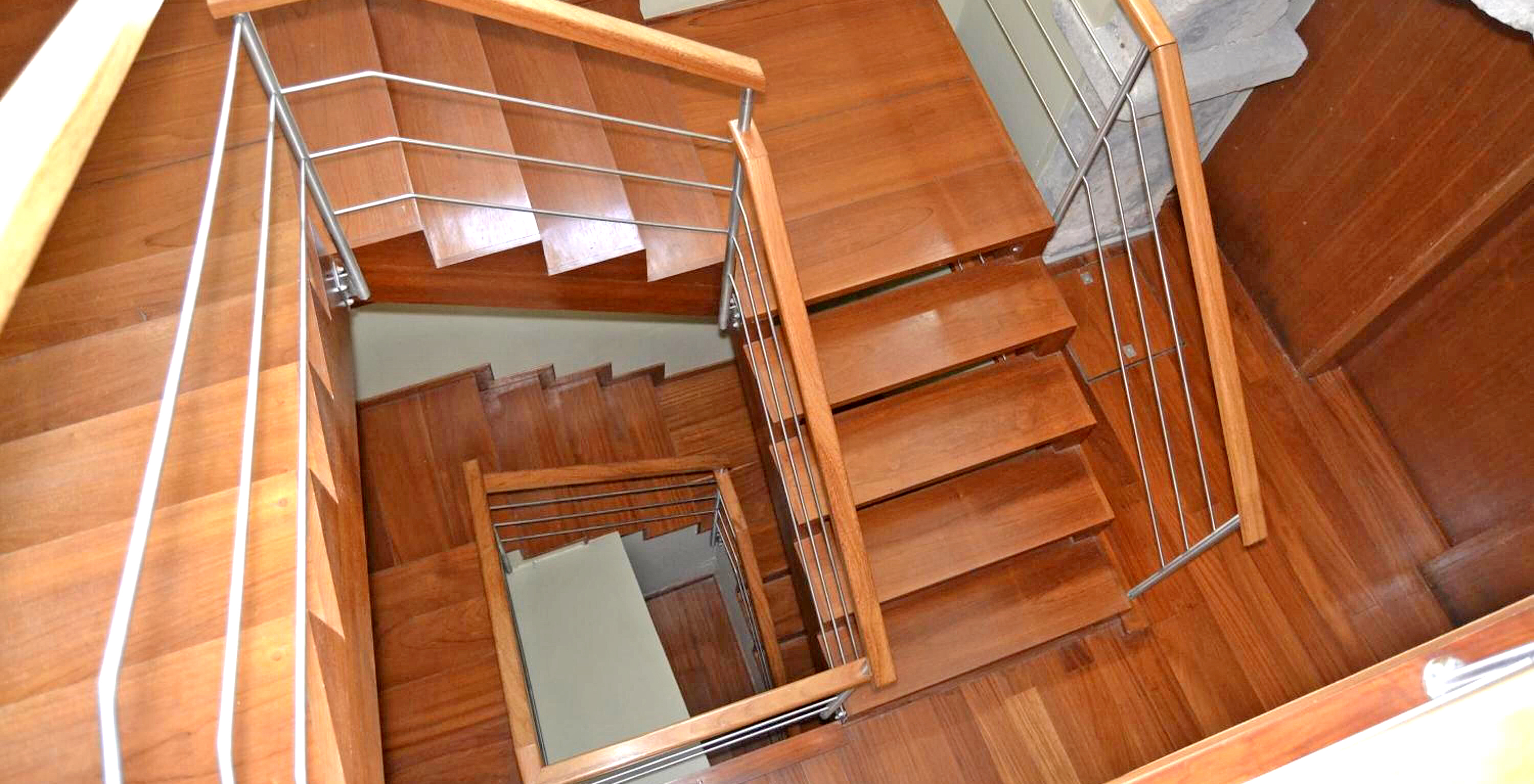 Wooden spiral stairs at Pousada Forte Angra do Heroísmo, a historic hotel on Terceira Island, Azores