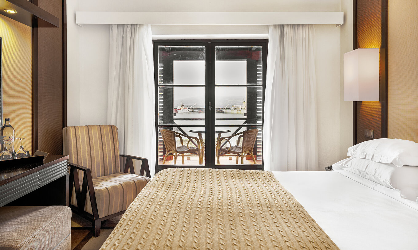 The Superior Family Room of The Pousada Forte Horta has a double bed and a balcony with sea view