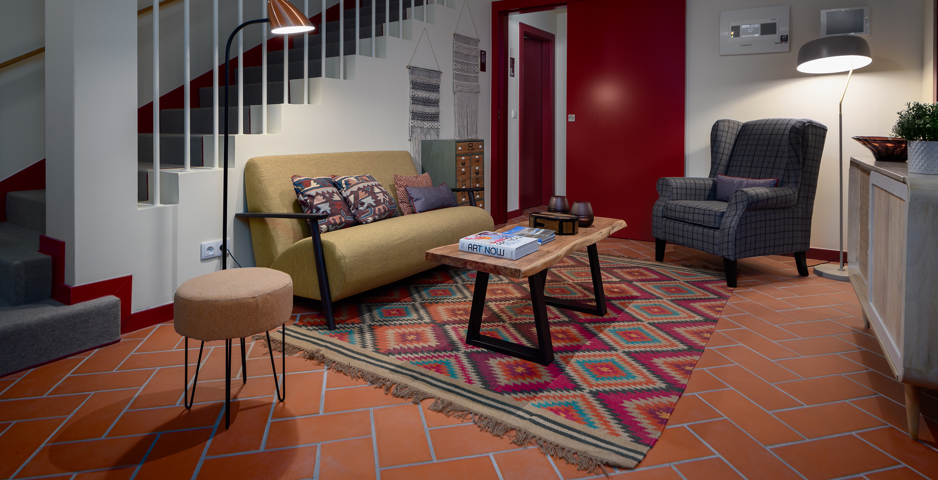 Living room with a sofa, coffee table, and dining table at Casa Lidador - Óbidos, Hotel in Óbidos