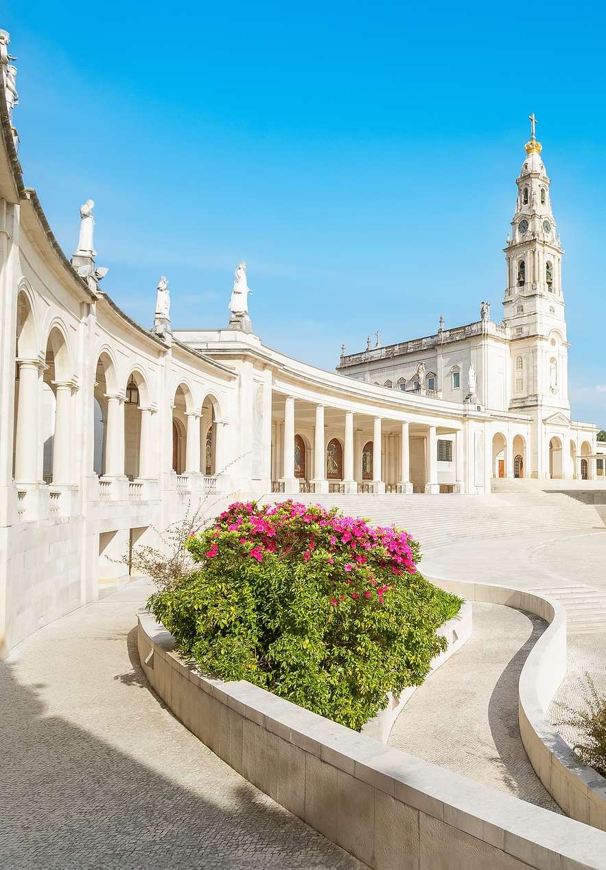 Fátima Sanctuary near Pousada Ourém - Fátima, Hotel Histórico Perto de Fátima with white arcades and bell tower