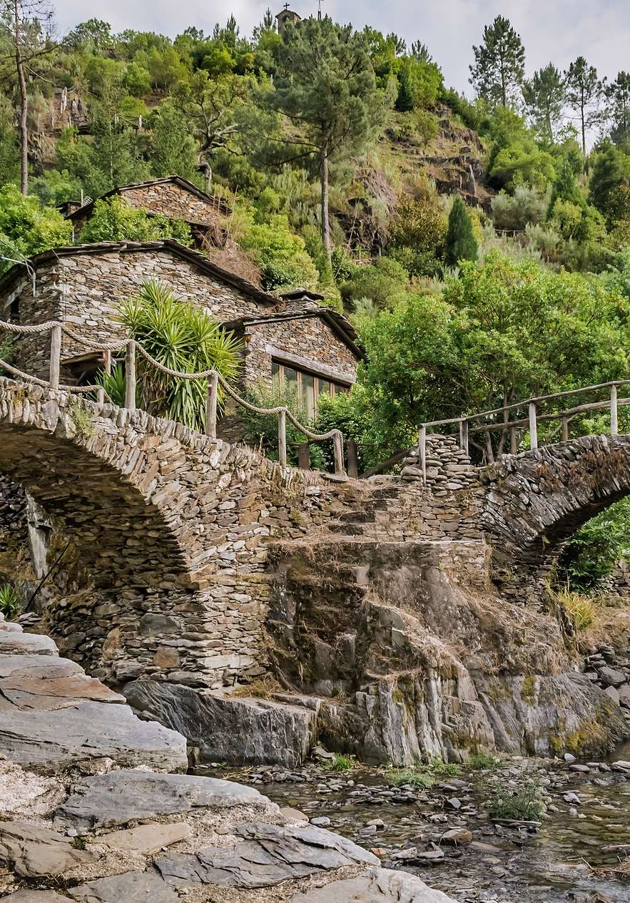 Stone houses and arched bridges in Piódão near Pousada Serra da Estrela, Hotel de Montanha no Centro de Portugal