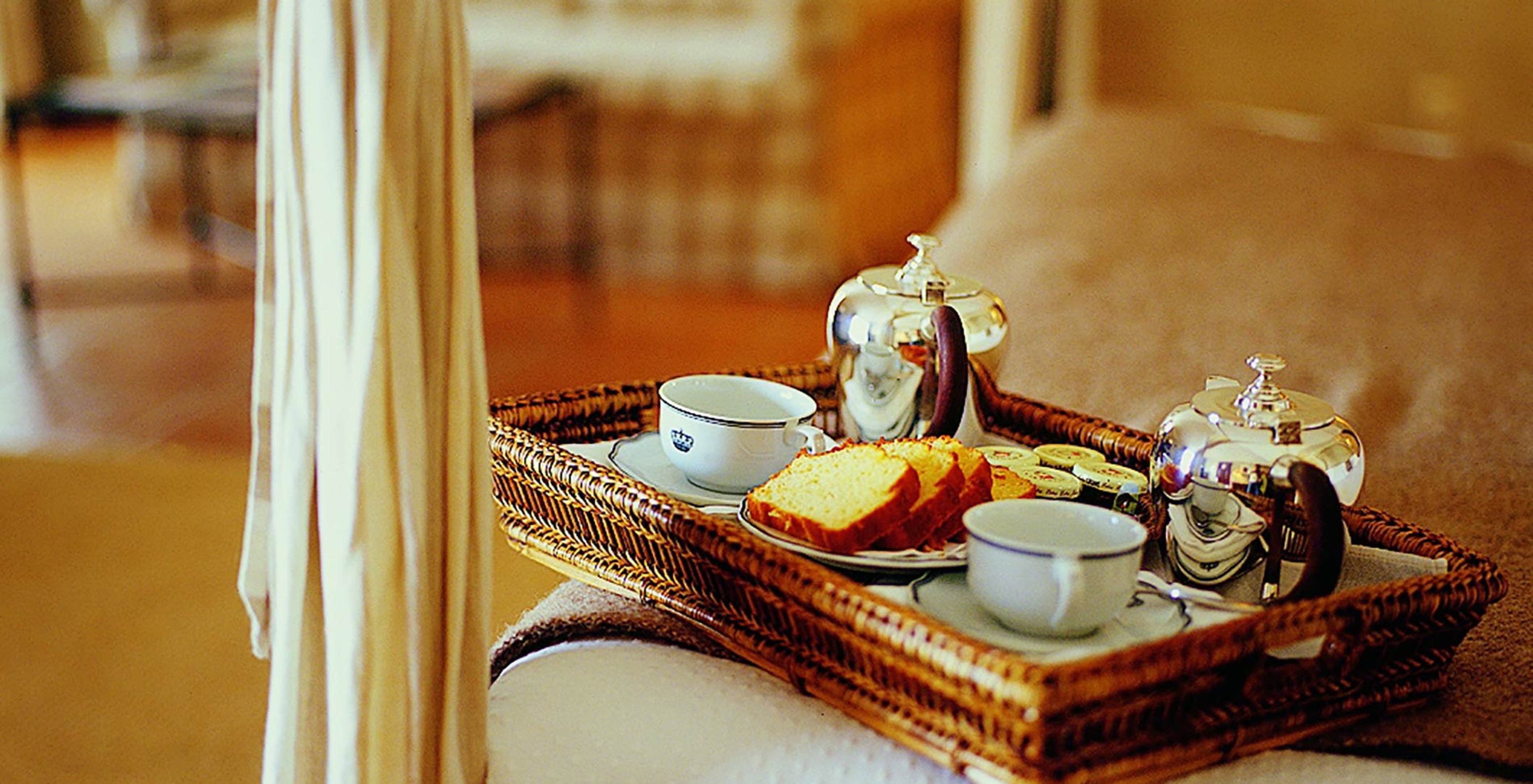 The Superior Twin Room with Balcony of The Pousada Convento de Belmonte has a tray from room service with tea and cakes