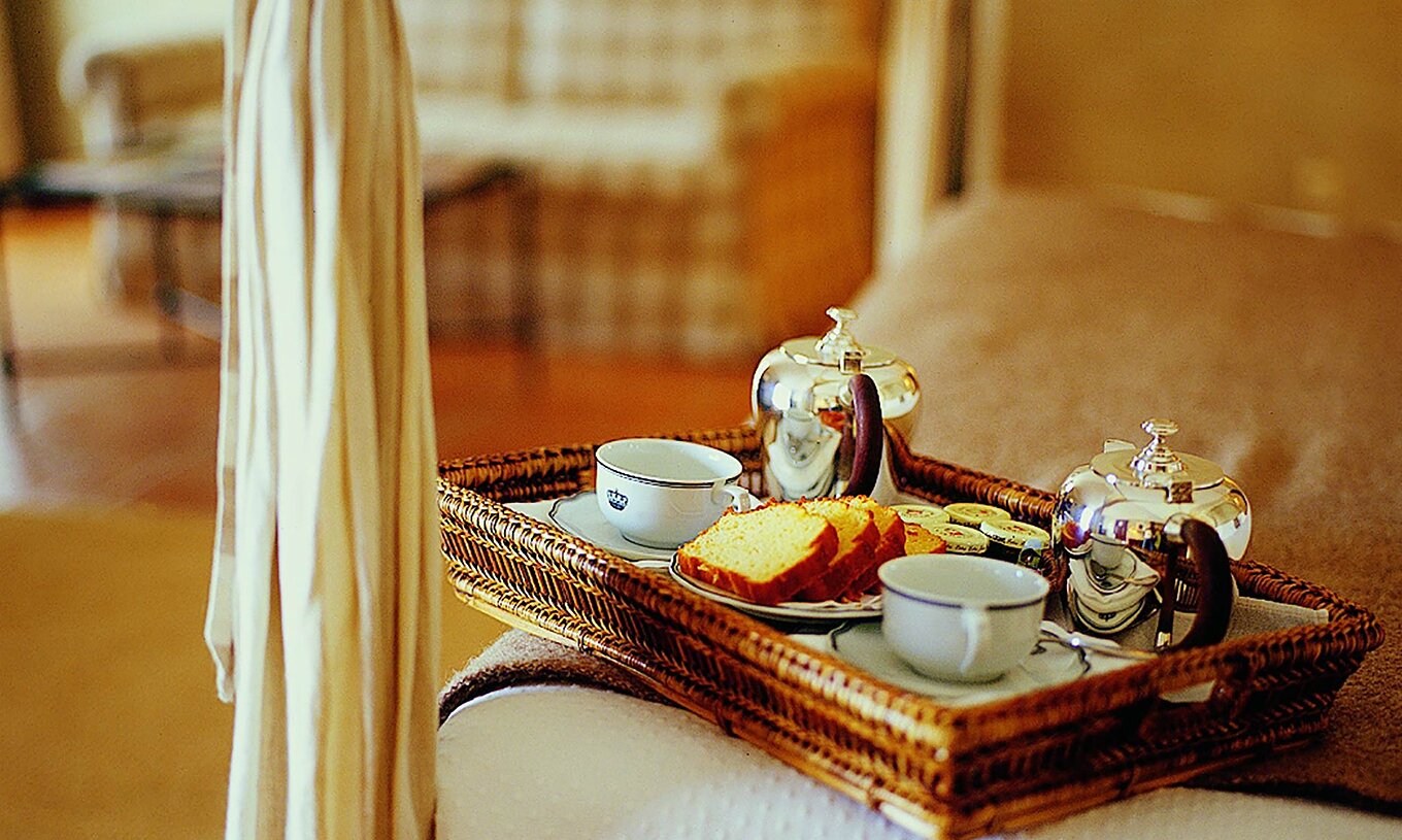 The Superior Twin Room with Balcony of The Pousada Convento de Belmonte has a tray from room service with tea and cakes