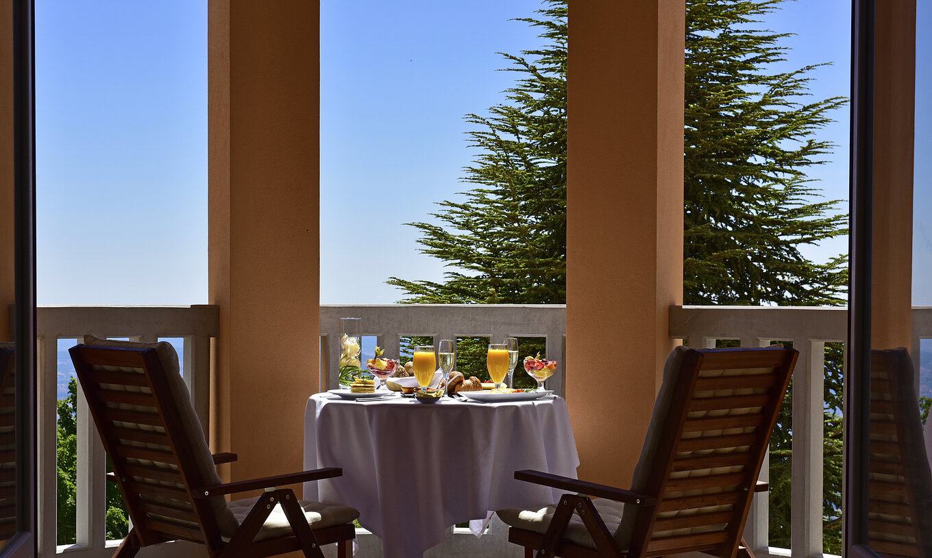 The Superior Torrão of The Pousada Serra da Estrela has a balcony with a table and a panoramic view over The Serra da Estrela