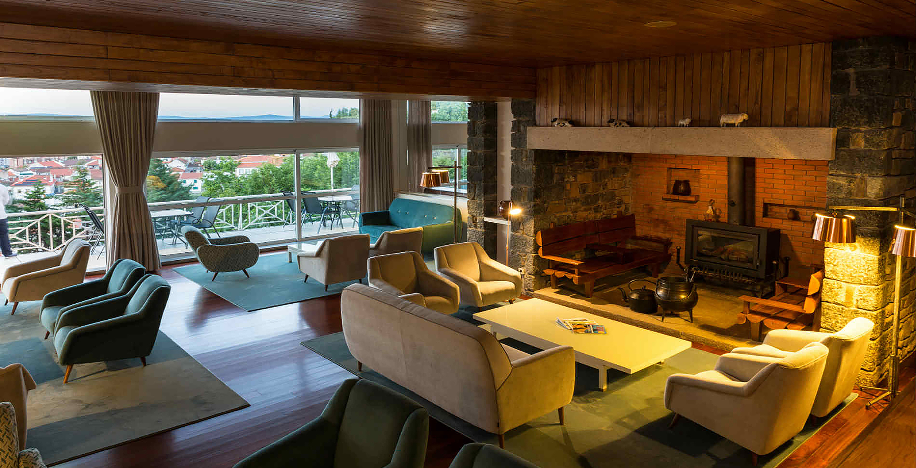 Pousada Bragança has an entrance hall with various chairs and sofas, with tables in front of a fireplace