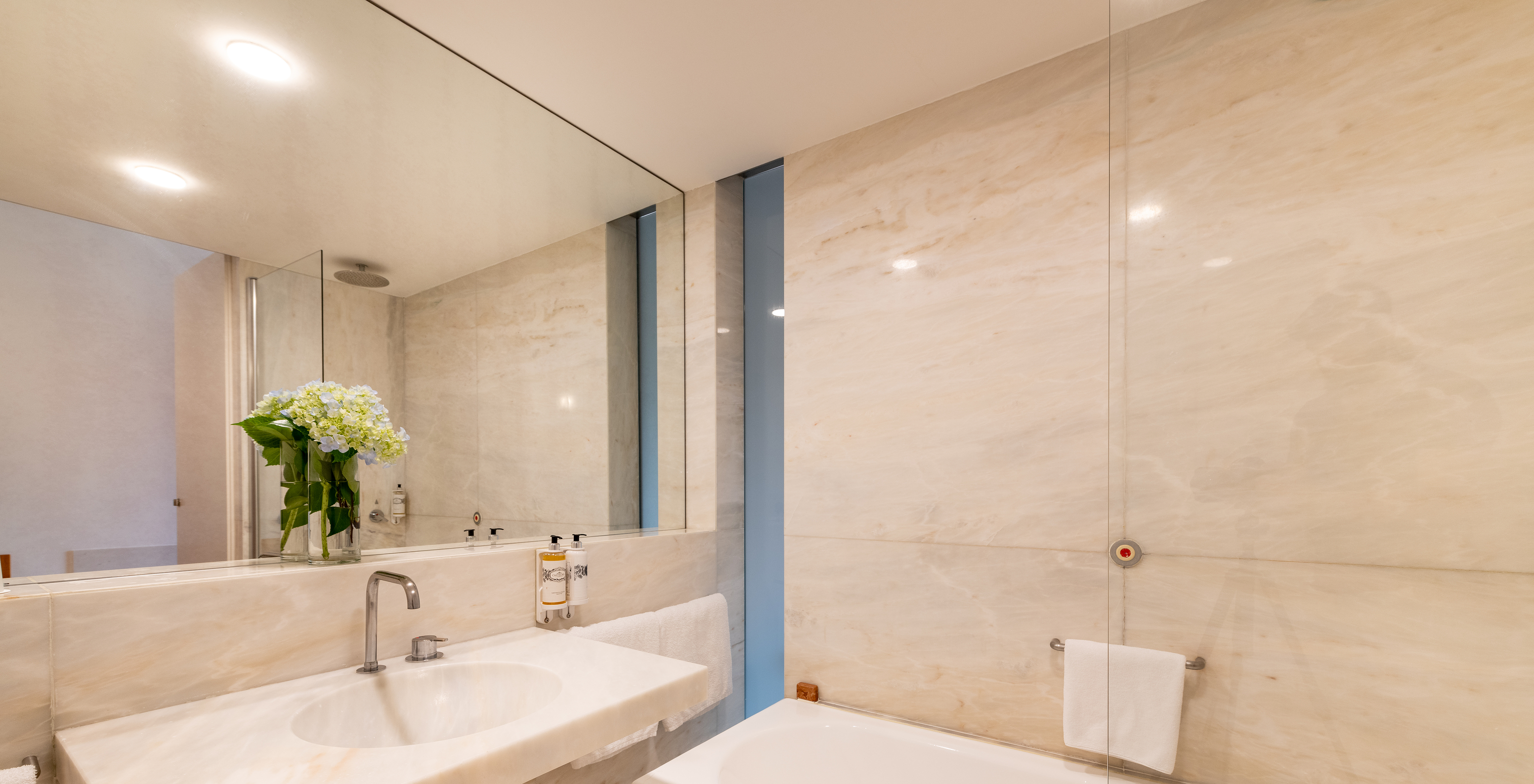 The Large Family of The Pousada Mosteiro Amares features a marble bathroom with a bathtub and sink