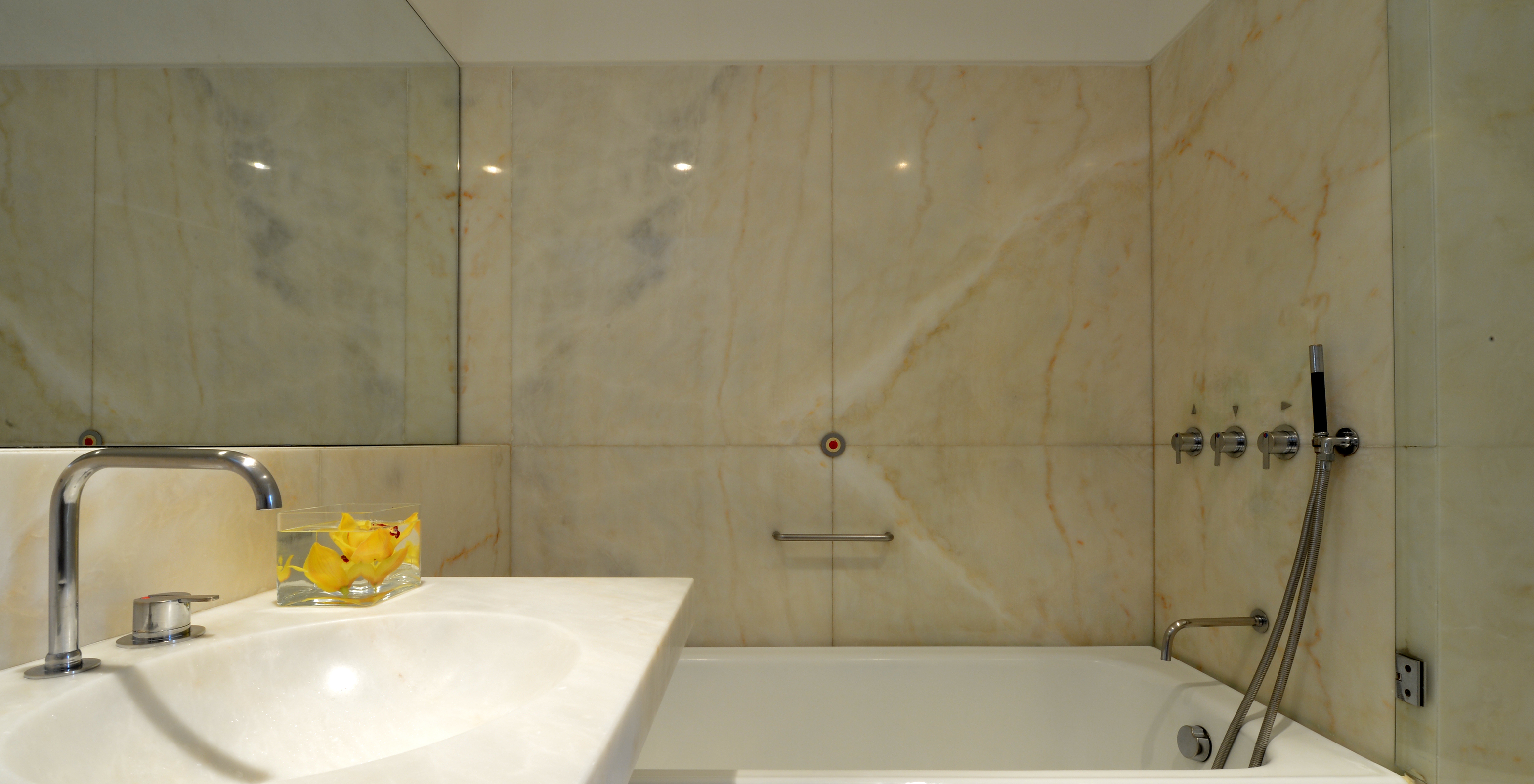 The Superior Room of The Pousada Mosteiro Amares features a marble bathroom with a bathtub and sink
