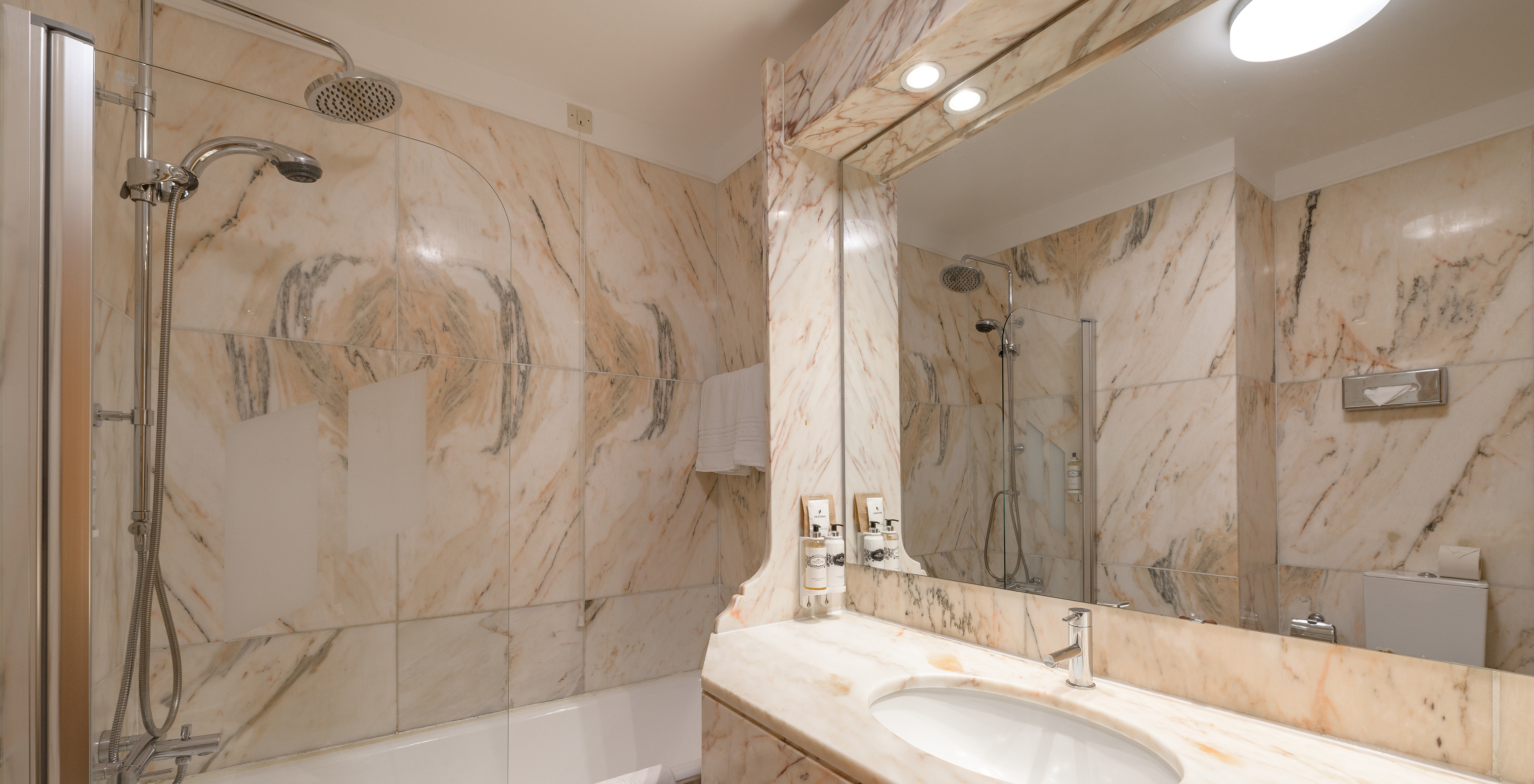 The Classic Family of The Pousada Viana do Castelo has a bathtub with a shower and a counter with a marble sink