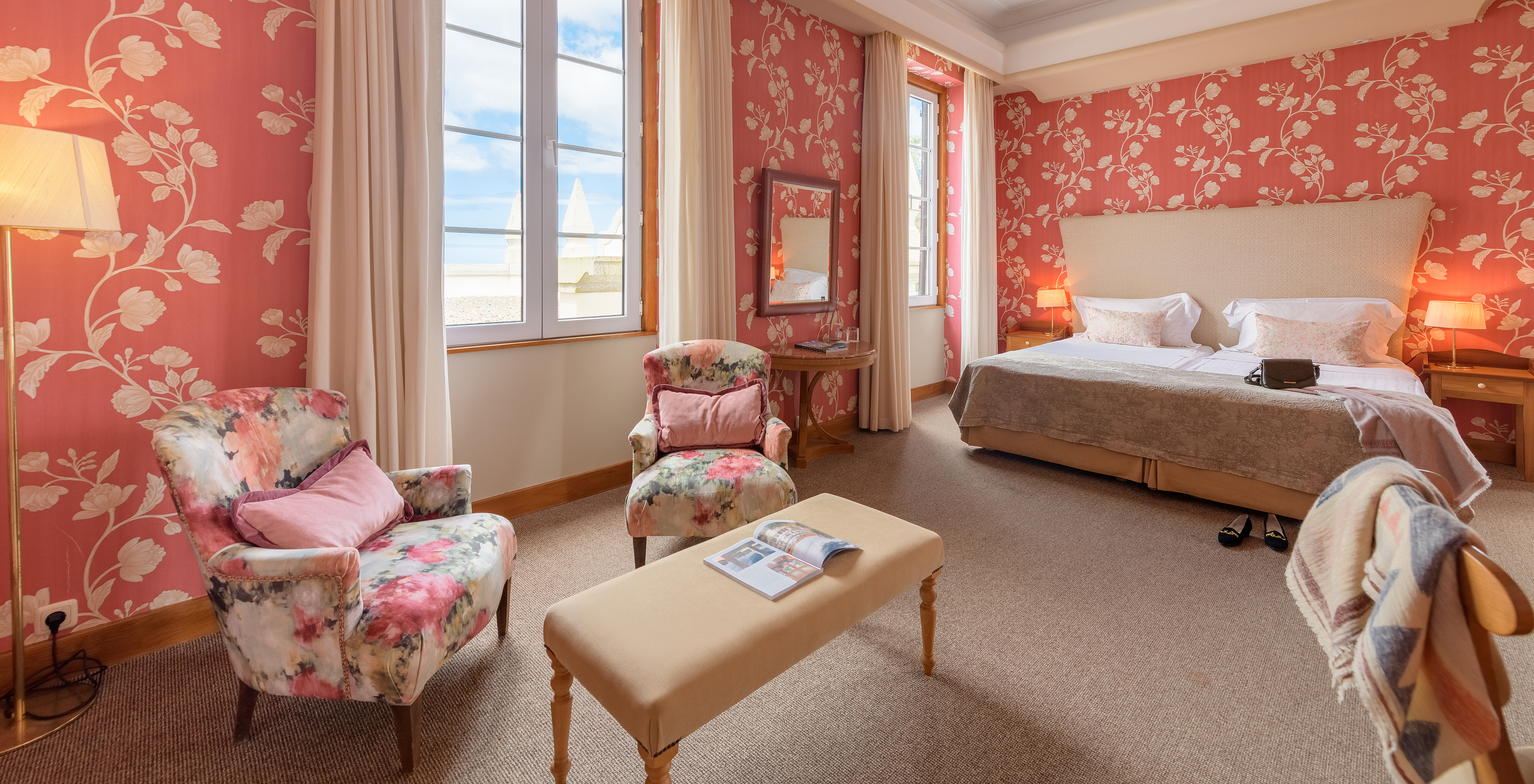 The Classic Family of The Pousada Viana do Castelo has two windows next to the bed and two armchairs where you can relax