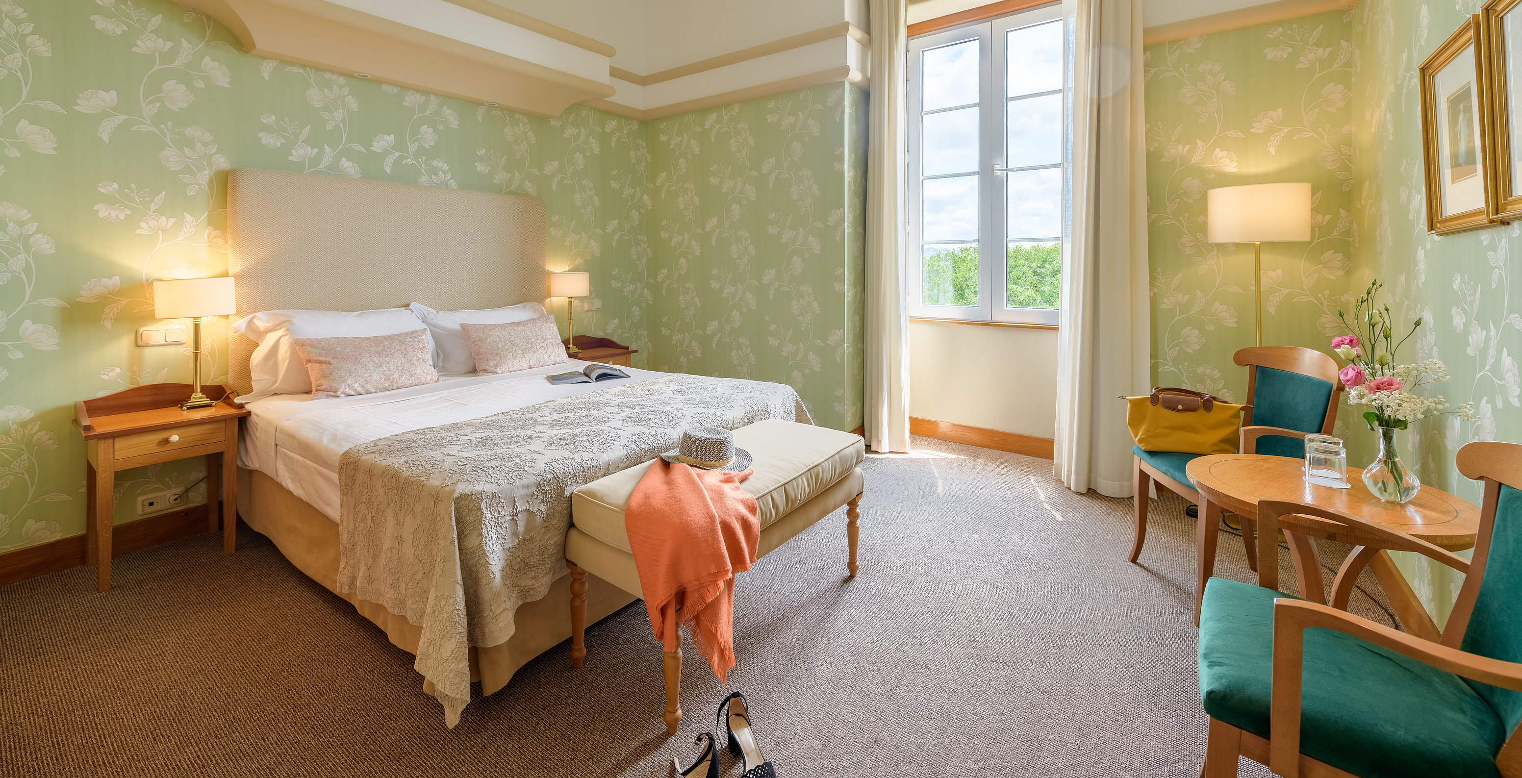 The Classic Room of The Pousada Viana do Castelo has a window next to the bed and two armchairs where you can relax