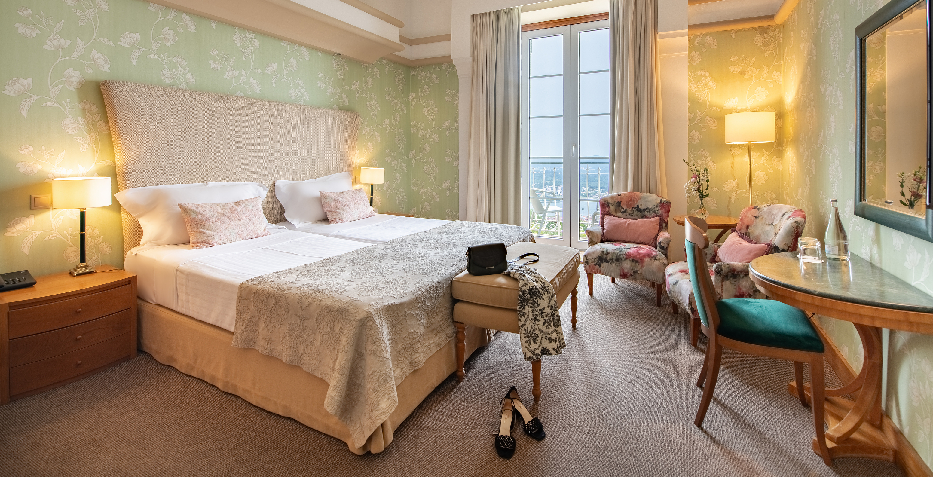 The Large Family of The Pousada Viana do Castelo has a window next to the double bed and armchairs where you can relax