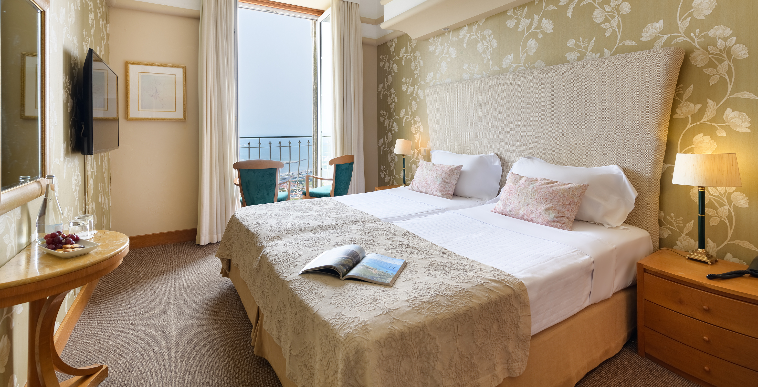 The Superior Room of The Pousada Viana do Castelo has a window next to the double bed and a television in front of the bed