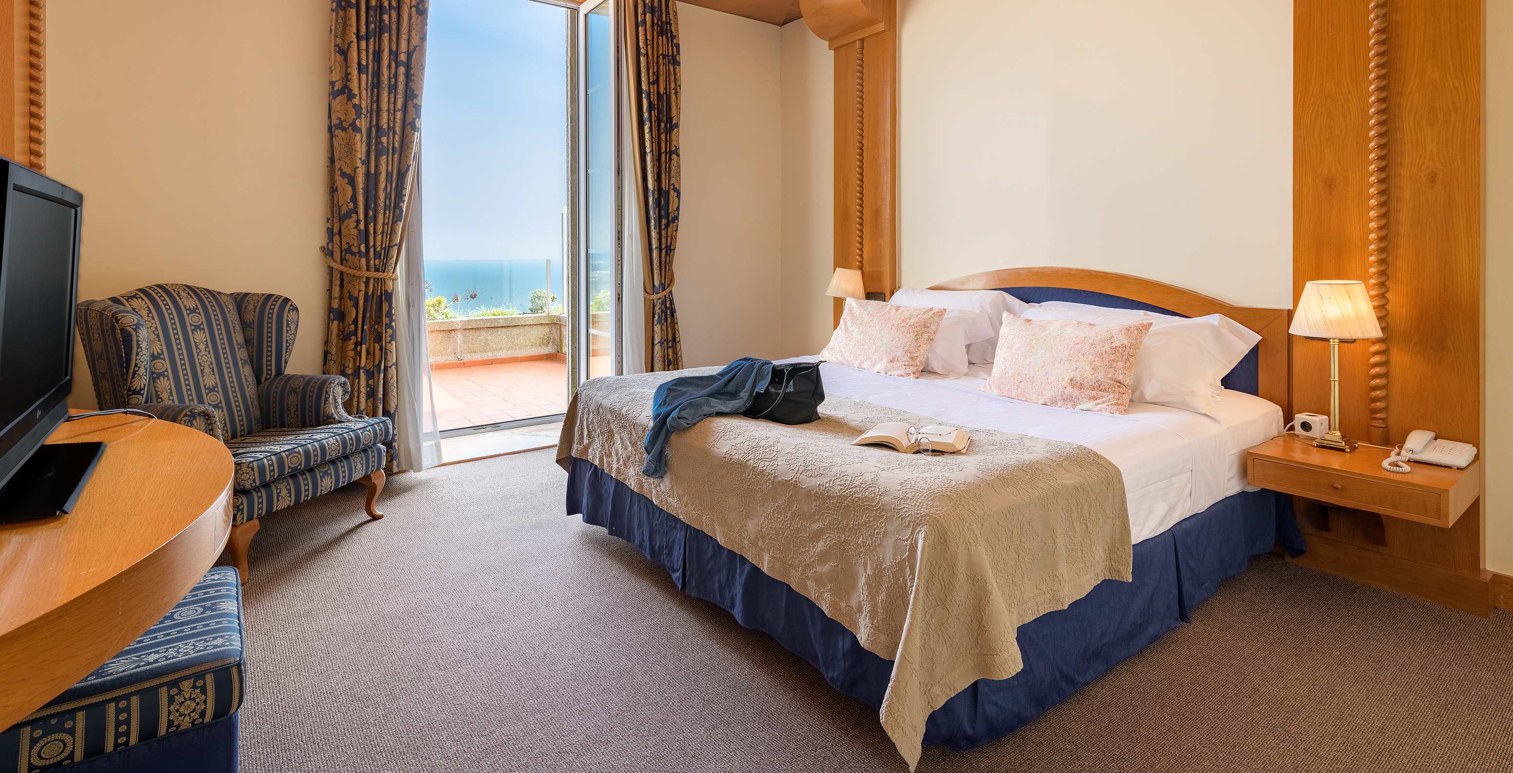 The Special Suite of The Pousada Viana do Castelo has a window that gives access to the balcony next to the bed