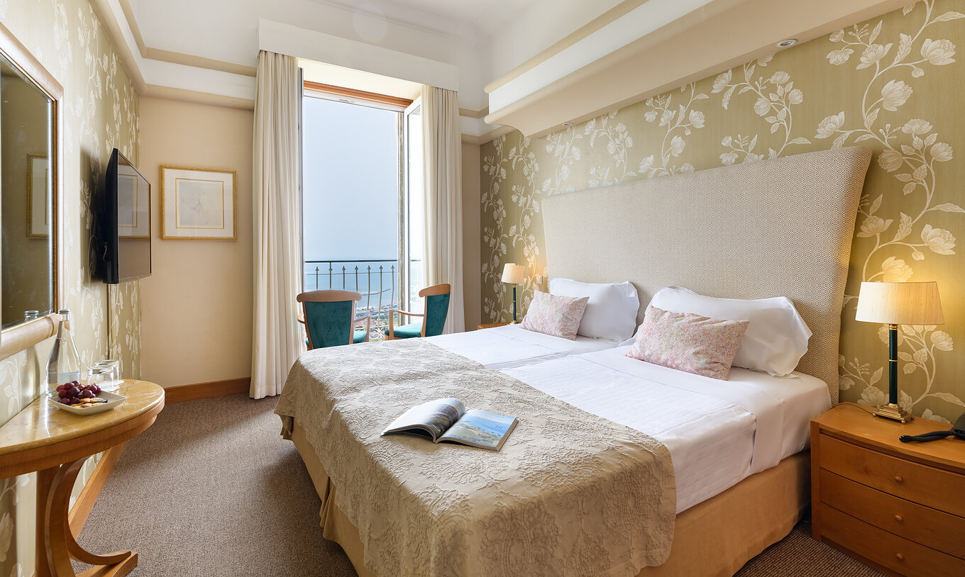 The Superior View Balcony Room of The Pousada Viana do Castelo has a window next to the double bed and a television in front of the bed