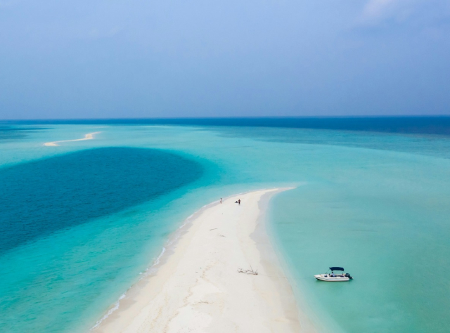Scenic view of a paradisiacal beach with crystal-clear turquoise water with white sandy shore