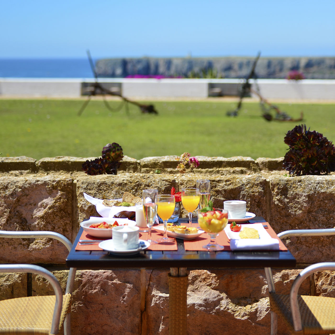 Breakfast at Pousada Sagres, a hotel 5 minutes from the beach, with fresh orange juice, fruit, custard tarts, and coffee