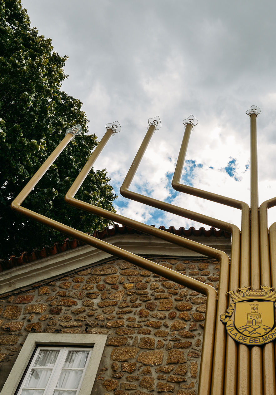 Detail of the entrance of the Jewish Museum in Belmonte with a large chandelier and the symbol of the Village of Belmonte