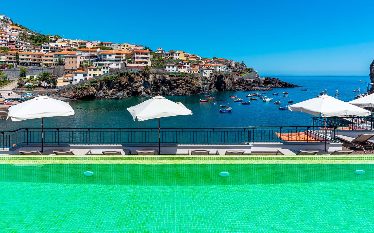 Rooftop outdoor pool of Pestana Churchill Bay, a historic hotel in Câmara de Lobos, Madeira