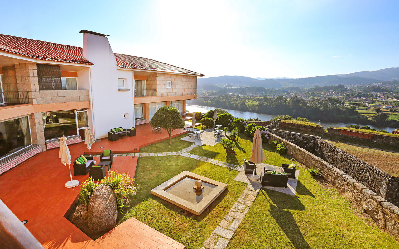 View of Pousada Valença, a charming hotel in Valença, with a garden overlooking the river and the city