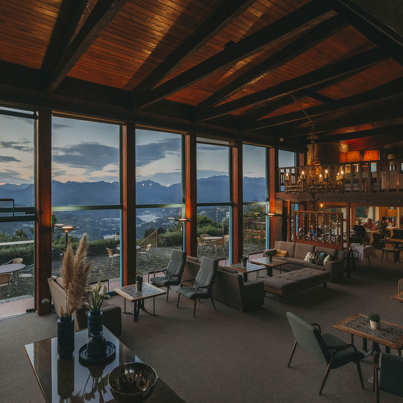 Cozy living room with sofas, with a glass wall, overlooking the Douro River