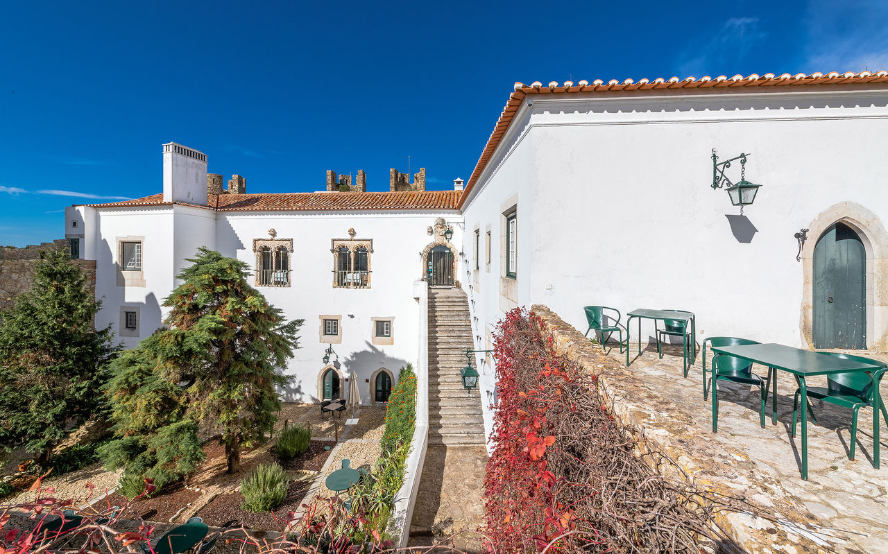 Visit the Pousadas website, with Pousadas in Portugal, featuring historic rooms with classic furniture and ornate ceilings