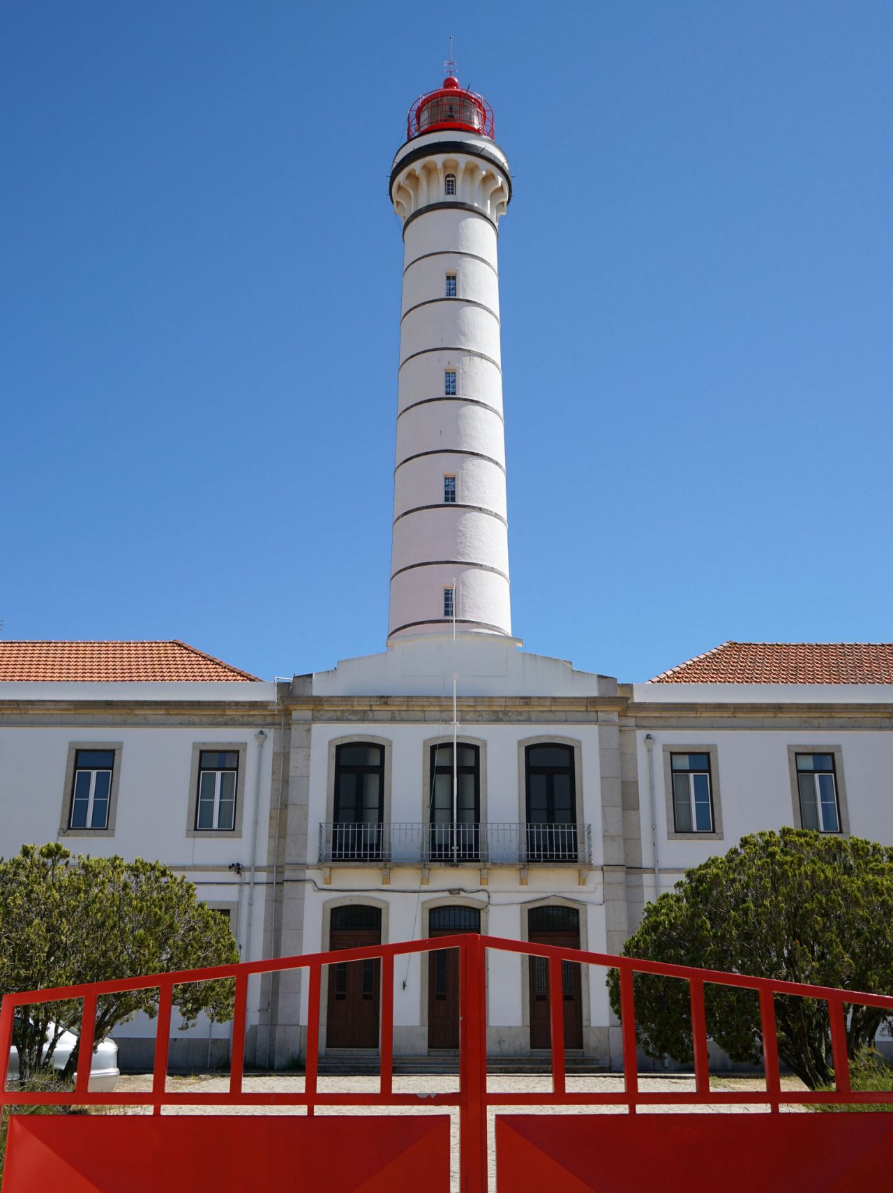 Lighthouse of Vila Real de Santo António imposing with a white tower that stands out against the blue sky