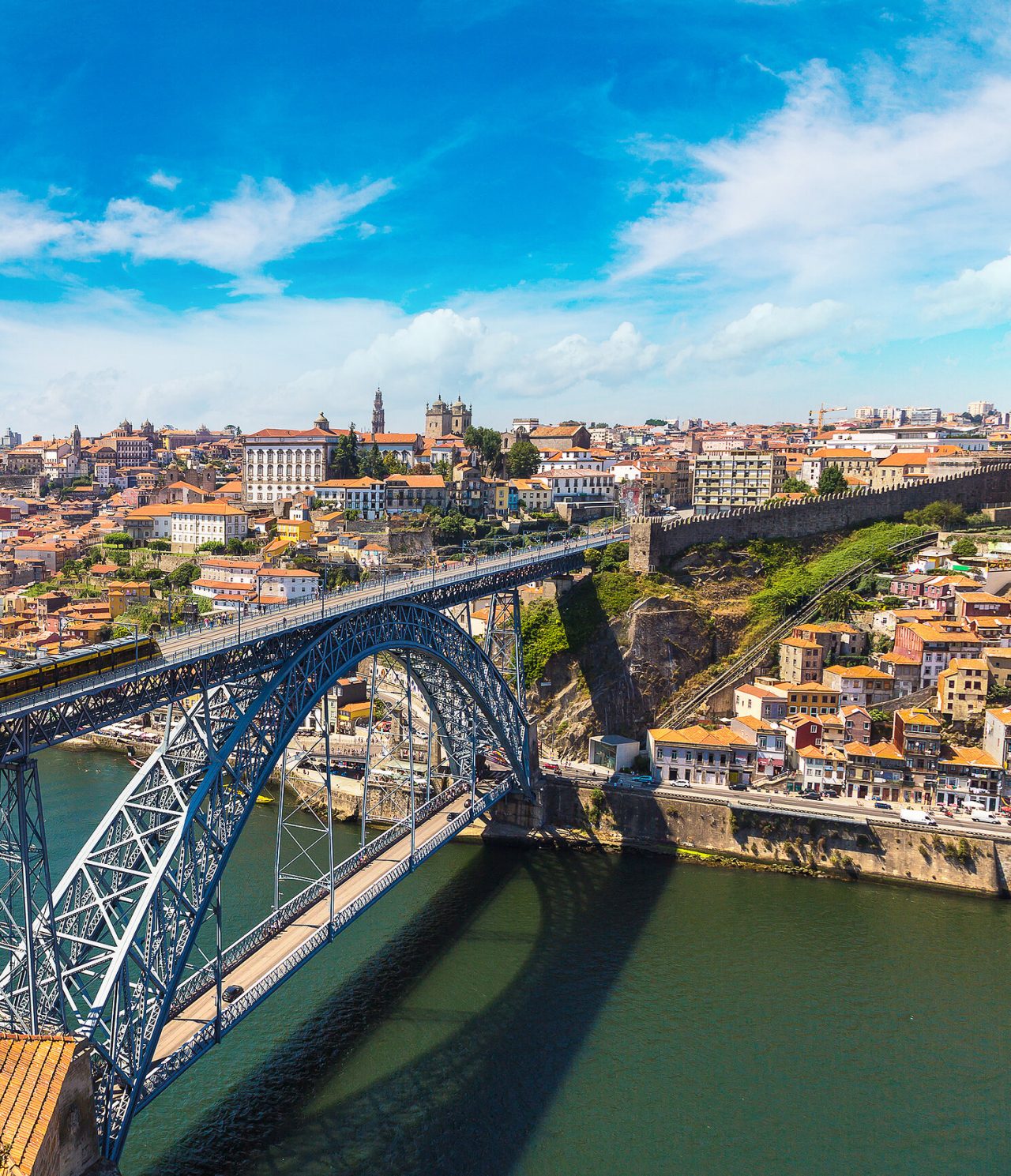 Aerial view of the Dom Luis I Bridge over the Douro River, the city of Porto and its historic buildings in the background